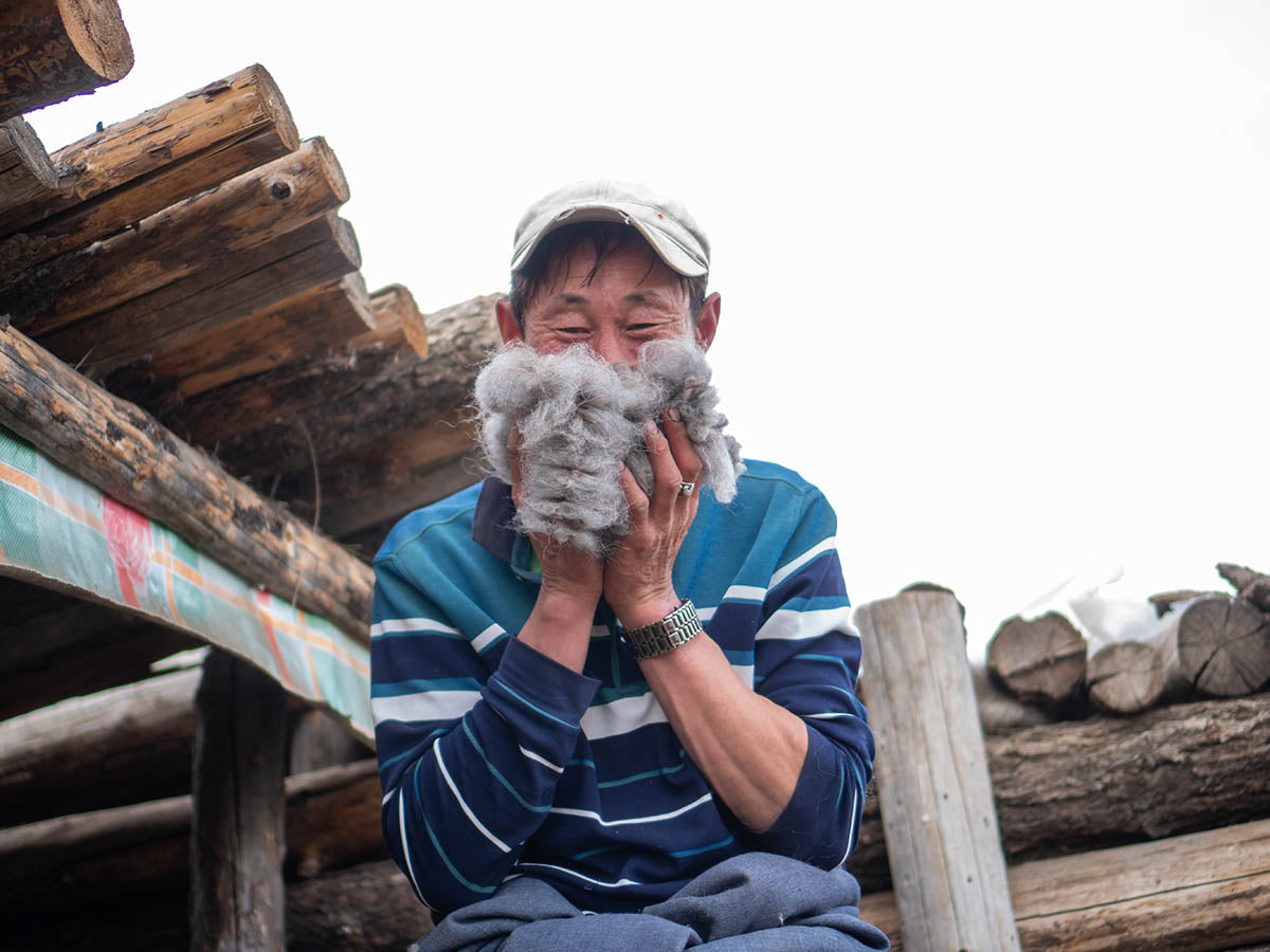 happy herder smelling fresh brushed yak wool