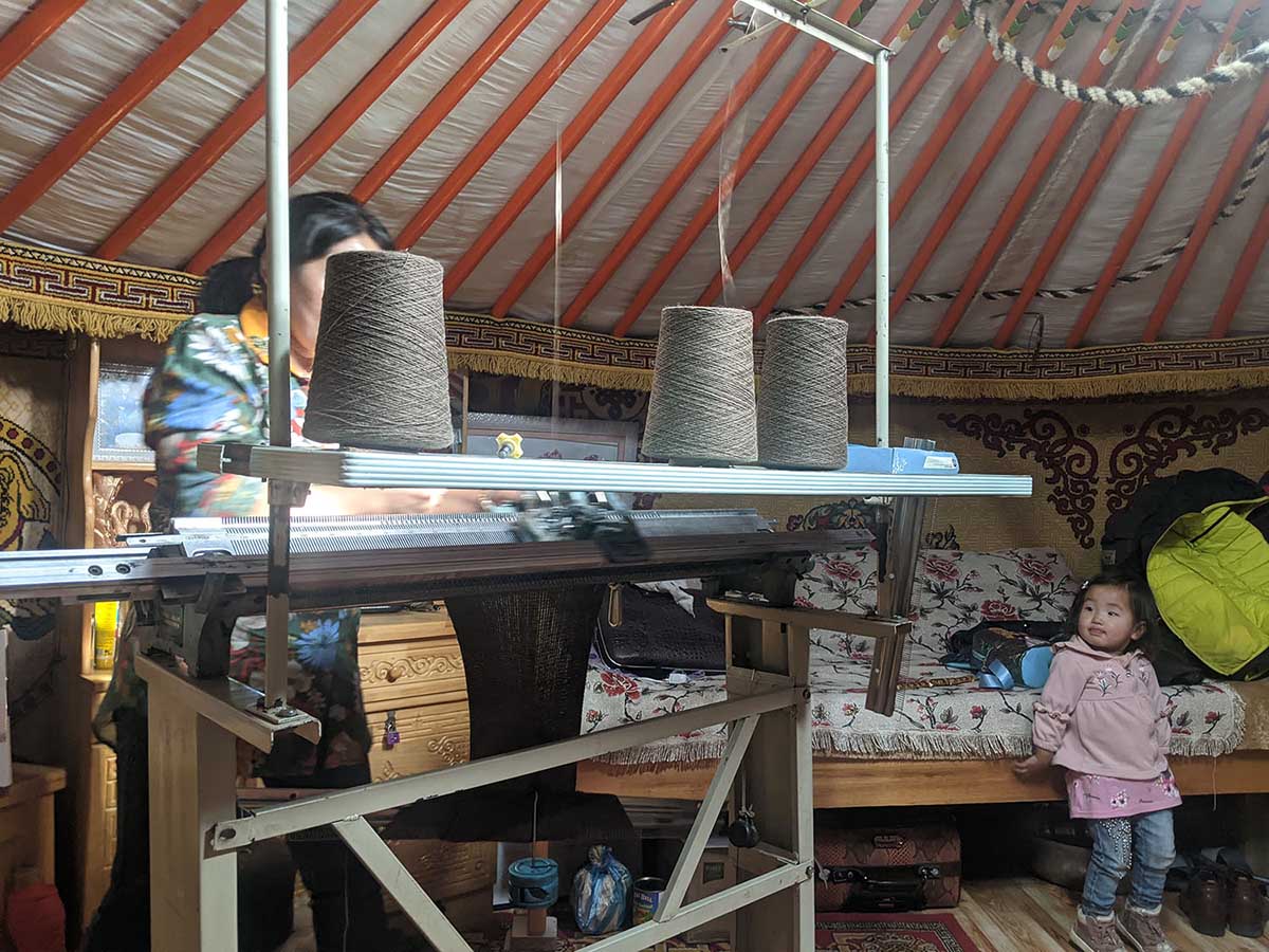hand looming baby yak wool products inside a Mongolian yurt